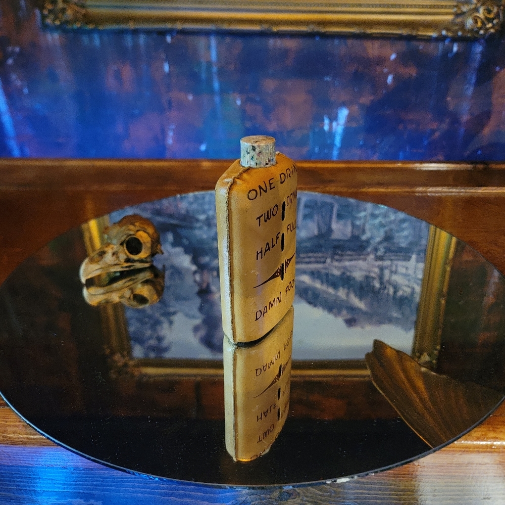 Vintage leather covered glass flask